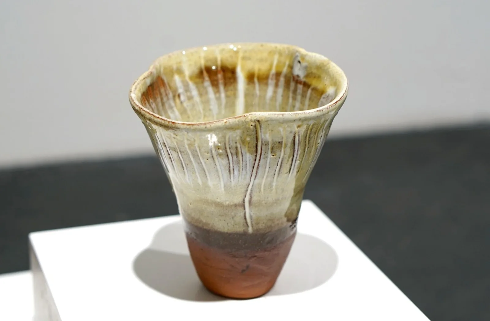 Fungi Vessel II, with a flared ridged rim, pale glaze and warm brown base.