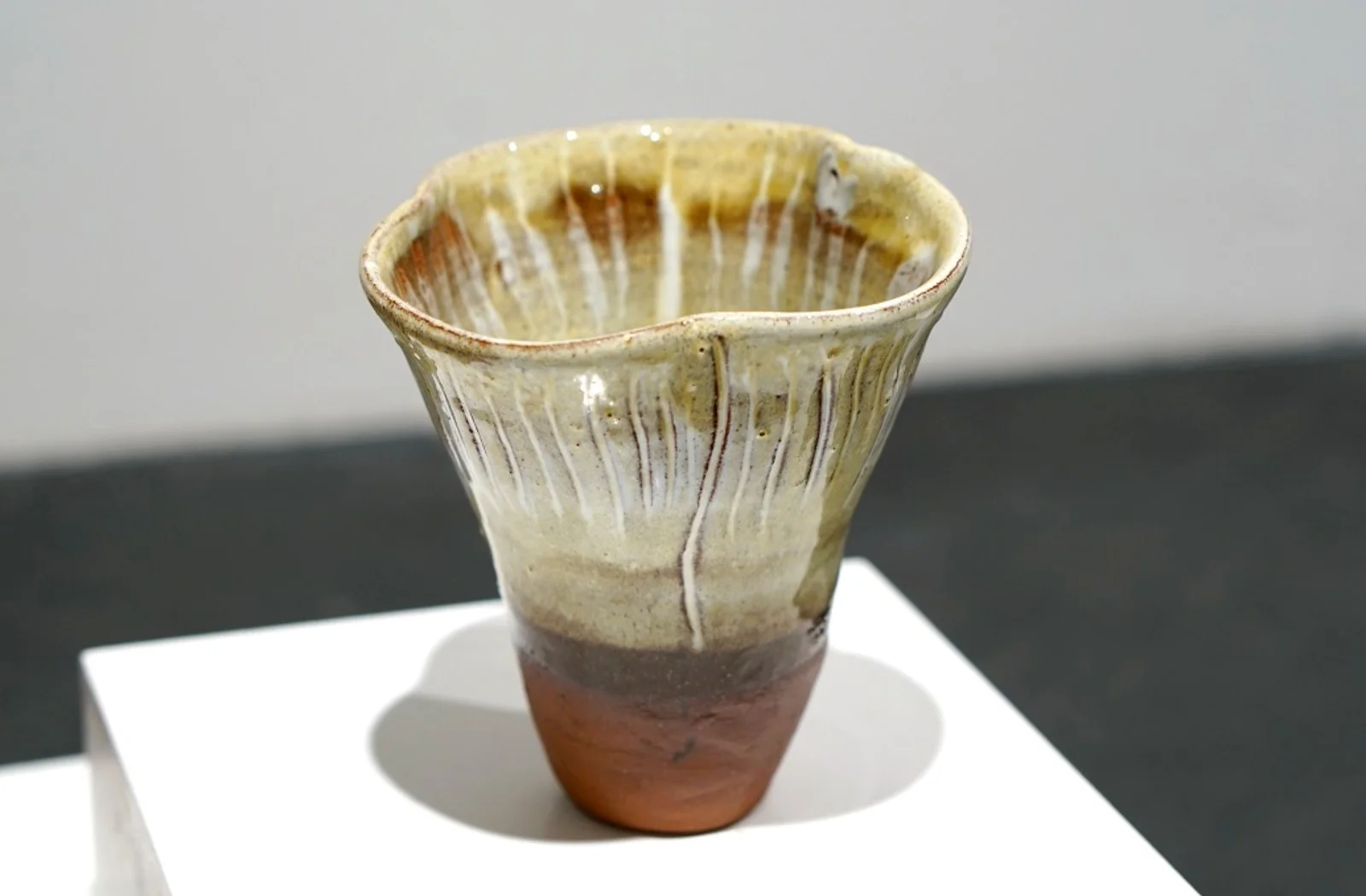 Fungi Vessel II, with a flared ridged rim, pale glaze and warm brown base.