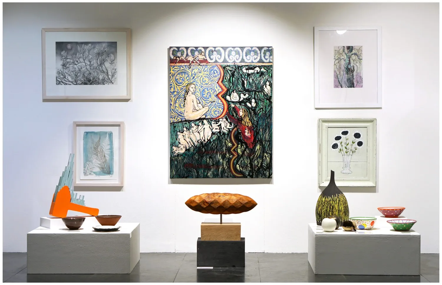 The Summer 2023 group exhibition, with ceramics displayed beneath paintings.