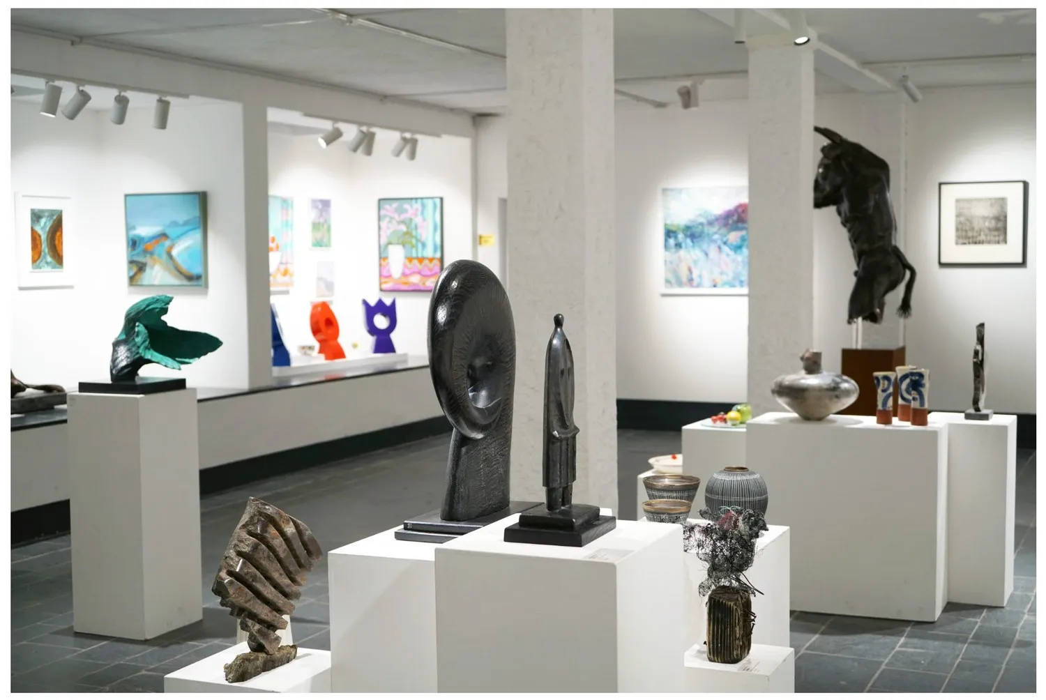 Sculpture and paintings in the Winter 2024 group exhibition.